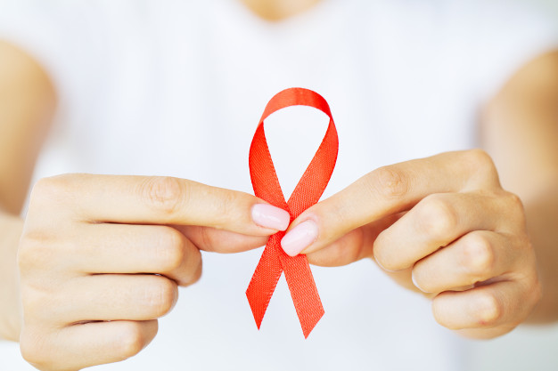 woman-holding-red-ribbon-emerges-from-critical-situation-after-overcoming-aids_118454-13000